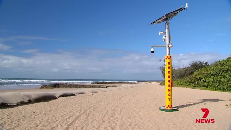 AIS supplied Emergency Response Beacon installed on a beach with solar panel and emergency signage